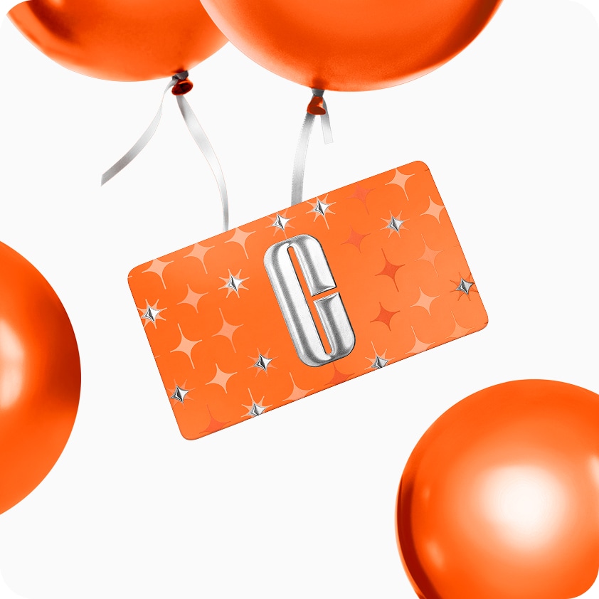 Selection of new brow and eye products dynamically placed on a glass shelf, in a brightly lit studio setting