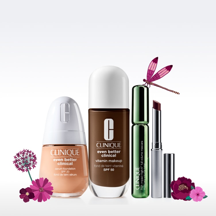 foundation, mascara, and honey lipstick aligned with flowers around 